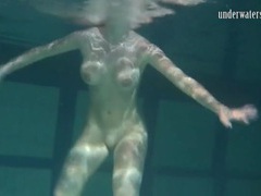 JerkMania presents: Naked brunette with big tits swims solo