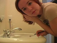 JerkMania presents: Redhead in tee shirt does her makeup