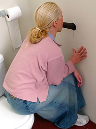 JerkMania presents: Blonde girl Jamie sits on the toilet and blows a black gloryhole dong